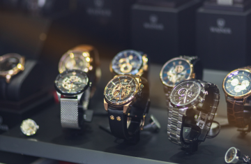 RFID Card 2 Luxury mechanical watches displayed on a lighted showcase with embedded RFID tags for anti-counterfeiting and tracking