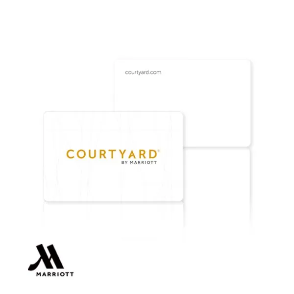 A clean white Courtyard by Marriott PVC hotel key card featuring gold brand typography and minimalist geometric patterns