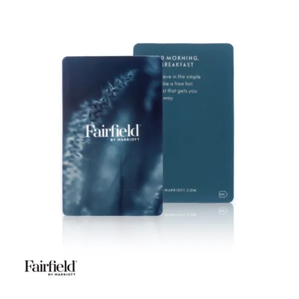 A sustainable hotel key card featuring dark blue botanical leaf textures customized for Fairfield Inn and Suites