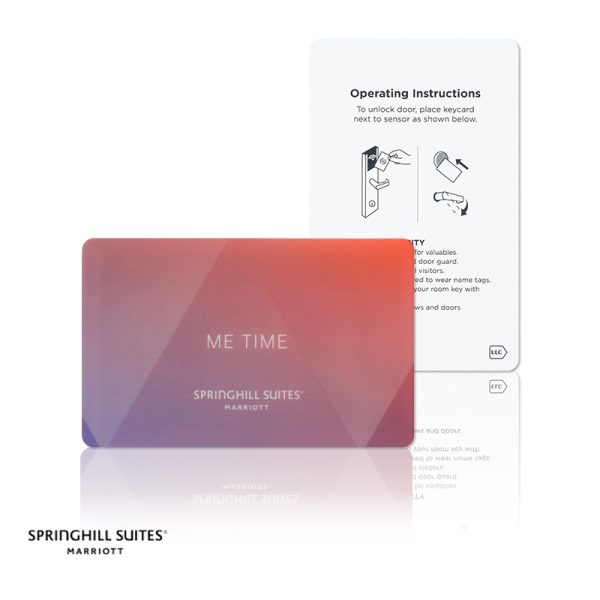 A deep red gradient BioPoly stone SpringHill Suites key card featuring a relaxation theme and brand logo