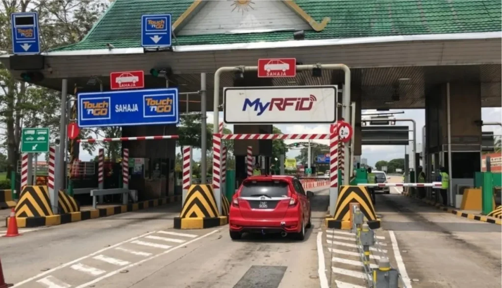 A car passing through an RFID-enabled toll gate under the MyRFID system.