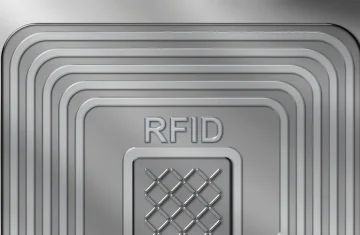 How UHF RFID Antenna Design Impacts Reading Range and Accuracy Abstract metallic RFID antenna coil pattern illustrating UHF RFID antenna design concept.