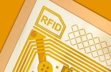 How to Ship RFID Cards Safely Best Practices for Secure and Damage-Free Delivery Close-up view of an RFID chip with golden circuit lines symbolizing smart card technology.