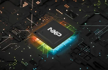Why NXP NFC Chips Are Trusted for Payment, Transit, and ID Applications Close-up of an NXP NFC chip on a circuit board with glowing colorful light effects, representing secure chip technology for payment and ID systems.