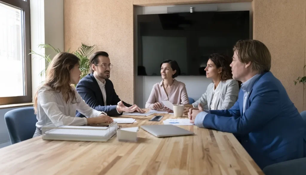 Business team in a meeting discussing sustainable material options.