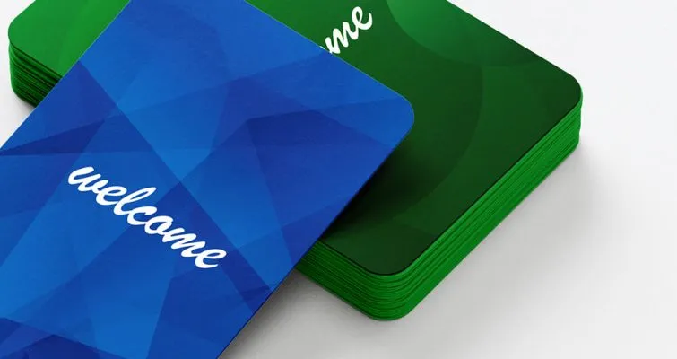 Eco Conscious Hotel RFID Key Cards. Sustainable FSC Certified Options stacked blue and green eco friendly hotel RFID key cards with welcome text, sustainable FSC certified accommodation key cards