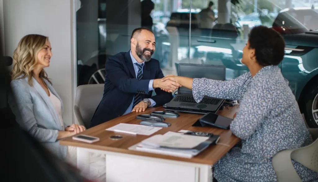 Hotel sales team closing a key card access system deal with a client.