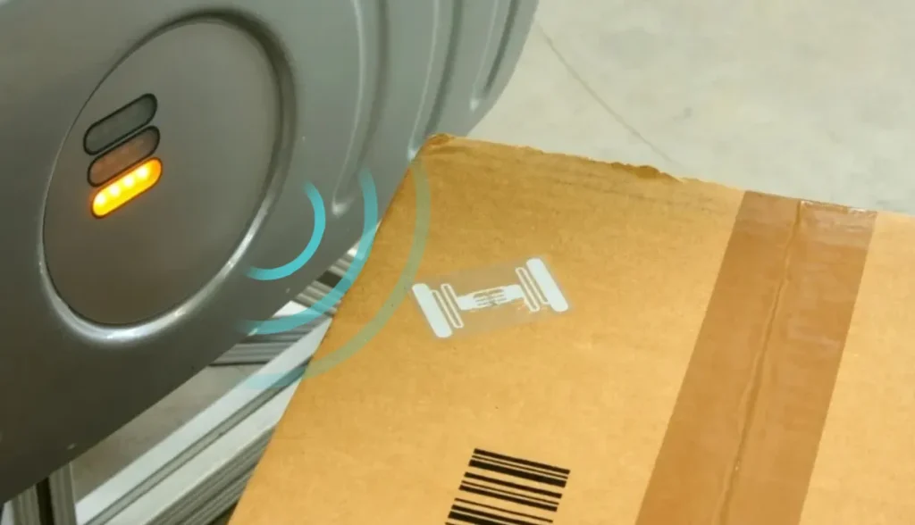 Factors affecting RFID tag range including reader power, environment, tag design, and interference